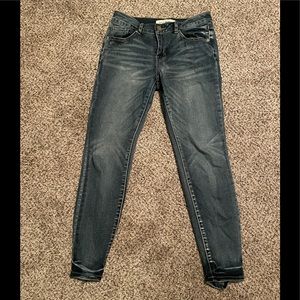 Skinny jeans with distressed bottom size:7